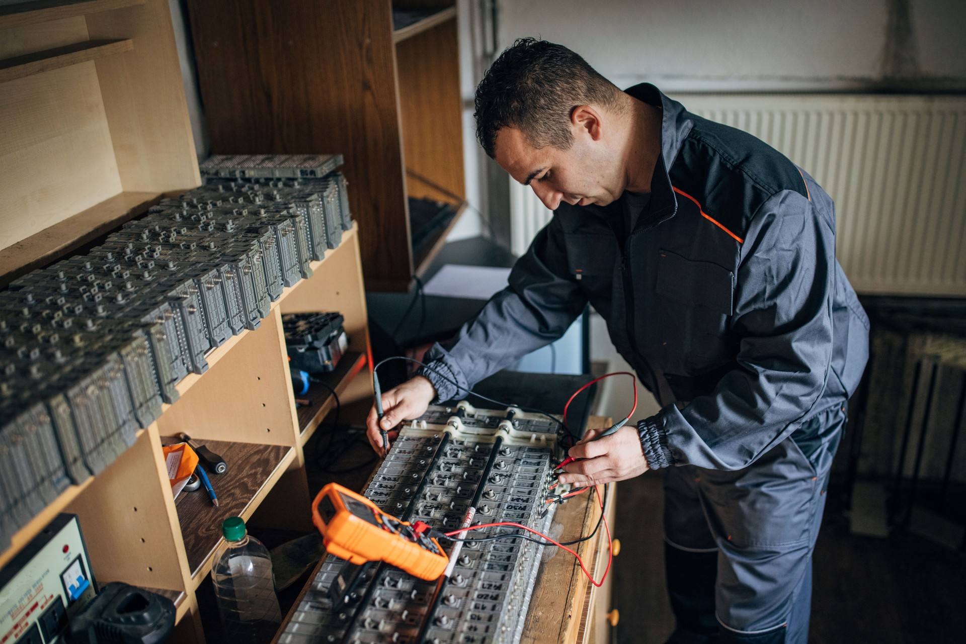 Mechanic doing service on electric car battery